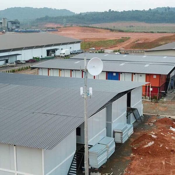 Aerial view of a new industrial estate with a wireless dish on a mast linking the site offices